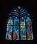 A detailed view of a stained glass window in the Basilica de Saint-Sauveur in Dinan in Brittany