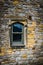 Detailed window on stone house in village