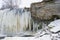 Detailof the Frozen Jagala waterfall with icicles hanging from rocks, view from above, Estonia