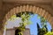 Details of the arch of the Generalife courtyard with its famous fountain and garden. Alhambra de Granada complex