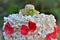 Details of a beautiful popcorn cake decorated with ribbons and a mini straw hat