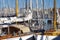 Details of beautiful wooden sailboats moored along the docks while waiting for the next adventure.