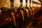 Details of the beer bar. Beer taps in a row in perspective. Warm tinting, different focus.  Close up of beer Tap. Selective focus.