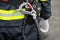 Details with the carabiner and harness of a firefighter