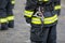 Details with the carabiner and harness of a firefighter