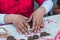 Details of children`s hands molding clay in an artistic learning workshop