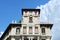 Details of classical renaissance building downtown Madrid, Spain against Vibrant blue sky with vivid white cloudscape