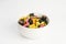 Details of colorful tasty sweet finish licorice candy on white background in bowl