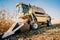 Details of combine harvester collecting corn and harvesting during autumn season