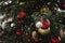 Details decorated Christmas kiosk with red, golden balls, garland. Outdoor fair. Xmas pattern. Close up. Winter