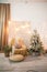 Details of the decorated New Year`s interior. Scandinavian living room and kitchen for Christmas. The comfort of homely rustic dec