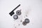 Details of a disassembled dirty shaver head and a cleaning brush on a light background. Soft selective focus. Copy space