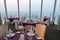 Details of elegant indoor restaurant tables with city View. Ho C