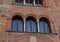 Details of the exterior of typical Italian buildings in Lucca, Tuscany, Italy.