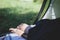 Details with the feet of a woman sleeping in a tent during a mountain trip