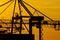 Details of a gigantic container gantry crane at sunset..