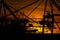 Details of gigantic container gantry cranes at sunset..