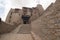 Details of the grey stone and wooden doors and windows , the balconies have no railings of Leh Palace in Ladakh, India.