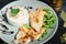 details of grilled chicken breast with risotto and parsley