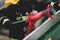 Details with the hands of a firefighter holding a fire suppression system hydrant on a hospital helipad