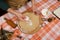 Details: hands of a woman housewife sprinkling flour on rolled out dough while making gingerbread cookies for Christmas