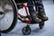 Details of an ill disabled young boy in a wheelchair