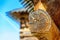 Details of log cabin corner joint with round logs and blurry roof of log cabin on the background