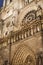 Details of the magnificent facade of the Parisian architectural cathedral Notre Dame de Paris by night