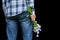 Details man`s hand with bouquet of wild flowers. Touchingly surprise, gift for your loved one, woman`s day, valentine`s day,