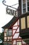 Details of old half-timbered houses with a cafe sign
