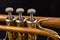 Details of an old patina covered trumpet. Musical instrument shown in magnification