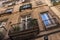 Details of the one of typical old residential buildings in the historical center of Barcelona in sunny day. Spain