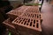 Details of a pile of stacked clay bricks with holes