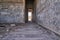 details of the ruins of an abandoned ghost town looking down the hallway