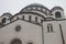 Details of Saint Sava temple Hram Svetog Save, in Serbian, windows and cupola with golden cross on top