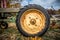 Details and tire on rusty old farm tractor