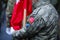 Details of a Turkish army soldier holding a flag and having Turkey and NATO insignia. Turkey and NATO relationship
