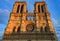 Details of the western facade of Notre Dame de Paris Cathedral facade with the oldest rose window and ornate tracery in the warm