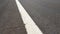 Details of white line on the road on the asphalt
