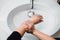 Details of woman scrubbing and washing hands at home . Hygiene and body cleaning concept detail