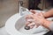 Details of woman scrubbing and washing hands at home . Hygiene and body cleaning concept detail, pandemic, coronavirus