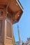 Details of the wooden fountain Sebilj, located in the main square of  Bascarsija district, with a minaret in the background