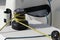 Details of yellow genoa sheet secured on self-tailing winch on sailing boat racer, boating concept