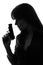 detective woman holding gun silhouette
