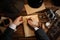 Detective writing with feather on paper at table, top view