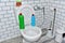 Detergent bottles and sponge for cleaning the toilet in the bathroom in home. Detergents bottles and kitchen sponges. Household