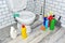Detergent bottles and sponge for cleaning the toilet in the bathroom in home. Detergents bottles and kitchen sponges. Household
