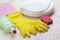 Detergent,sponge, dishes, rag and latex gloves