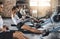 Determination keeps the fitness dream alive. Shot of a group of young people working out with rowing machines in the gym