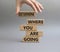 Determination symbol. Wooden blocks with words Determine where you are going. Beautiful grey background. Businessman hand.